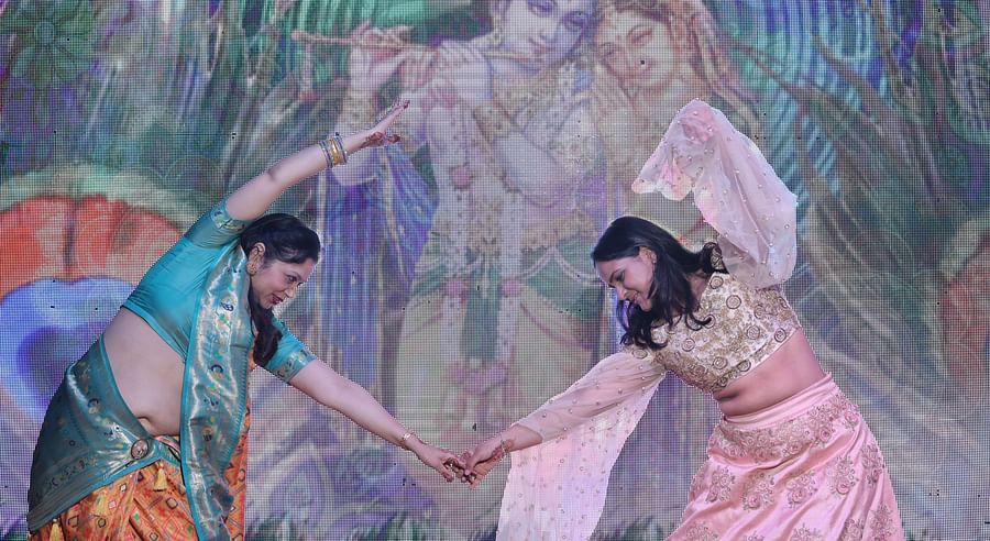 alt-text Close-up of an artistic dance performance with vibrant cultural elements at Shri Radha Brij Vasundhara Resort & Spa.